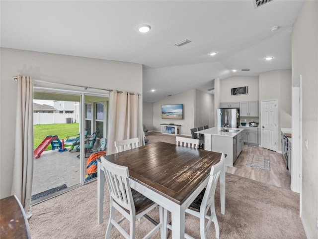 13105 Fruitville Way, Riverview, FL 33579 - dining room featuring lofted ceiling, light carpet, and recessed lighting