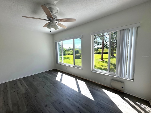 2459 Columbia Dr Unit 39, Clearwater, FL 33763 - unfurnished room with a ceiling fan, a textured ceiling, and dark wood finished floors