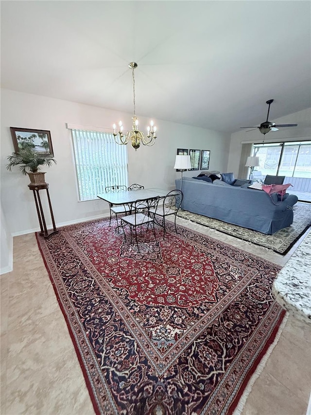 663 Jamaica Cir, Lakeland, FL 33803 - dining area featuring a chandelier, ceiling fan, and lofted ceiling