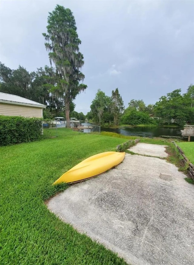 2014 Nancy Ave, Lutz, FL 33548 - view of community featuring a yard and a water view