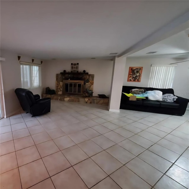 2014 Nancy Ave, Lutz, FL 33548 - living area featuring a fireplace and light tile patterned floors