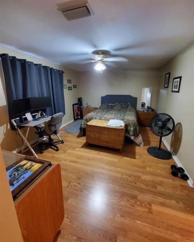 2014 Nancy Ave, Lutz, FL 33548 - bedroom featuring wood finished floors, an office area, and a ceiling fan