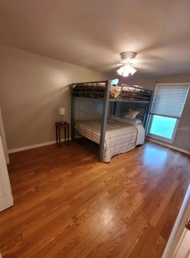 2014 Nancy Ave, Lutz, FL 33548 - bedroom with wood finished floors and ceiling fan