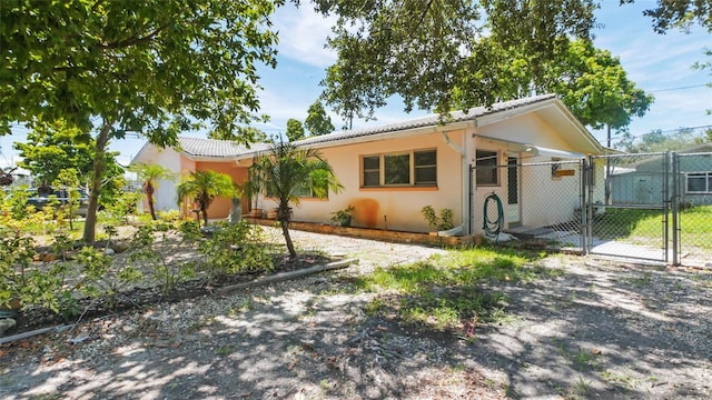 4720 Coronado Way S, Gulfport, FL 33711 - view of front of house with a gate and stucco siding