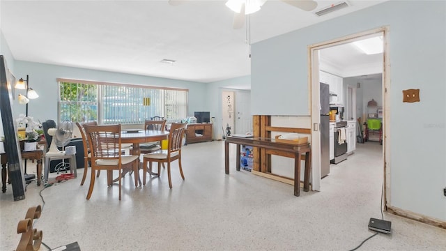 4720 Coronado Way S, Gulfport, FL 33711 - dining space with dark aggregate flooring and ceiling fan