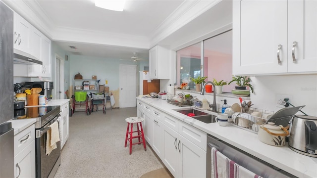 4720 Coronado Way S, Gulfport, FL 33711 - kitchen featuring stainless steel appliances, light countertops, ornamental molding, white cabinets, and ventilation hood