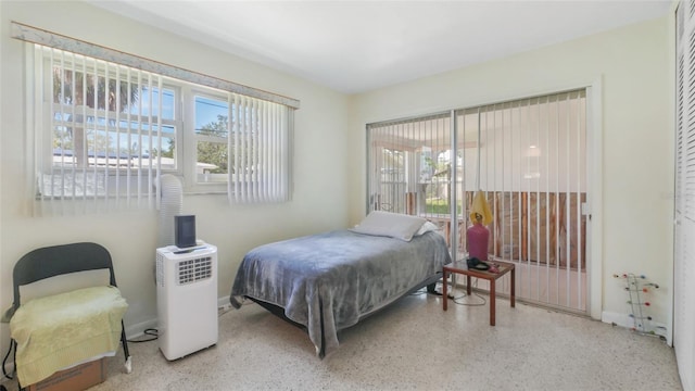 4720 Coronado Way S, Gulfport, FL 33711 - bedroom featuring speckle patterned floor and multiple windows