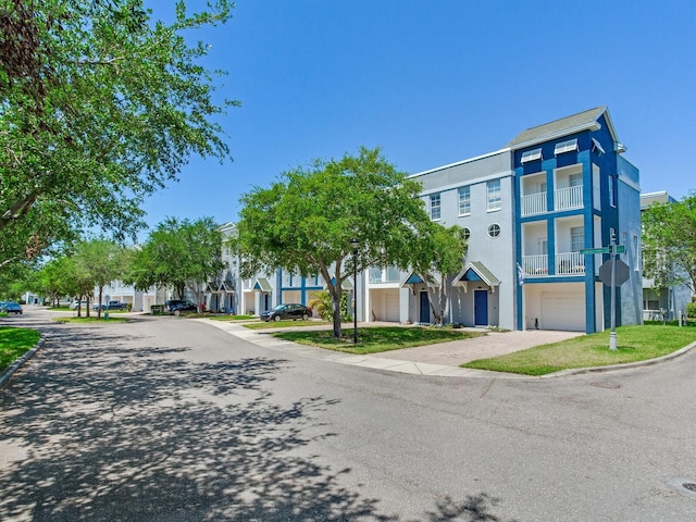 4503 Legacy Park Dr, Tampa, FL 33611 - view of asphalt road with curbs and traffic signs