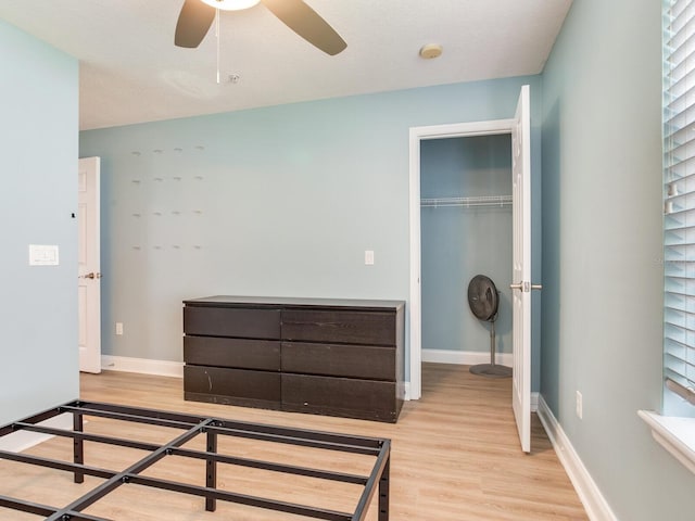 4503 Legacy Park Dr, Tampa, FL 33611 - bedroom featuring wood finished floors, a closet, and ceiling fan