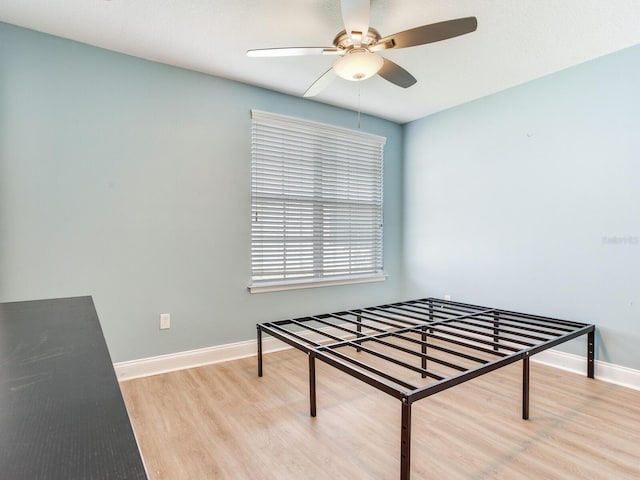 4503 Legacy Park Dr, Tampa, FL 33611 - bedroom with wood finished floors and a ceiling fan