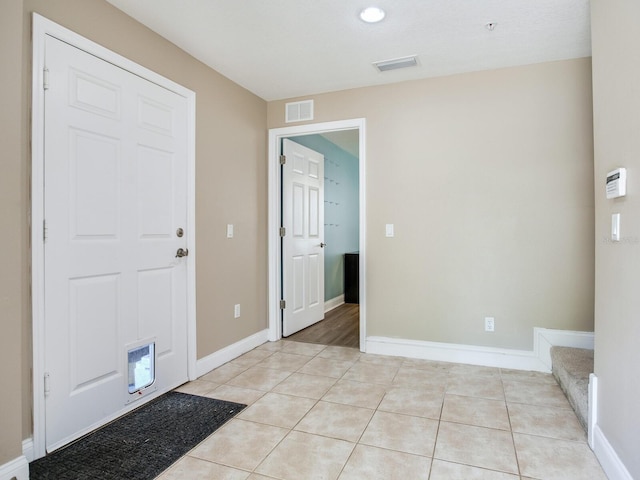 4503 Legacy Park Dr, Tampa, FL 33611 - entrance foyer with light tile patterned flooring and baseboards
