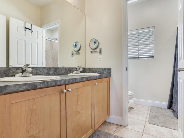 4503 Legacy Park Dr, Tampa, FL 33611 - bathroom with double vanity, tile patterned floors, and a shower