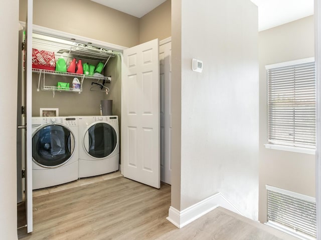 4503 Legacy Park Dr, Tampa, FL 33611 - washroom with washer and clothes dryer and wood finished floors