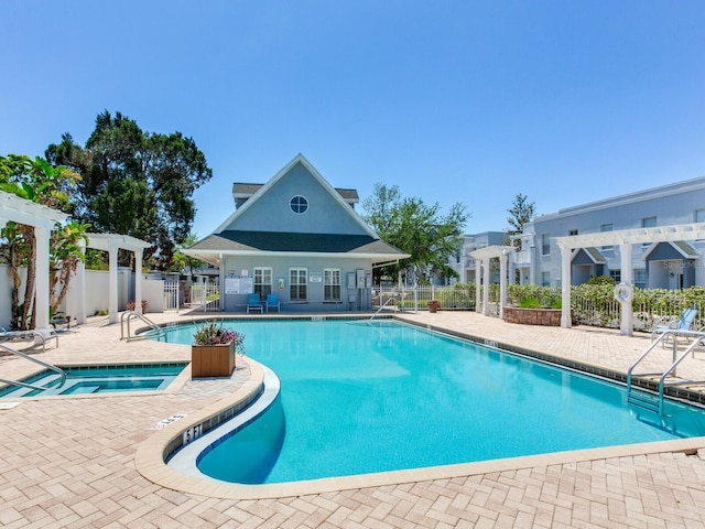 4503 Legacy Park Dr, Tampa, FL 33611 - community pool featuring a hot tub, a pergola, and a patio area