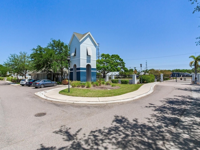 4503 Legacy Park Dr, Tampa, FL 33611 - view of asphalt street with sidewalks, curbs, and street lights