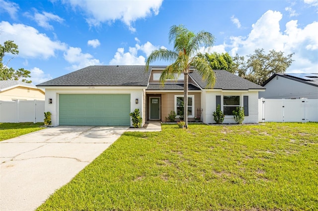 12106 Clearbrook Ct, Riverview, FL 33569 - view of front of home with an attached garage, concrete driveway, a gate, brick siding, and roof with shingles