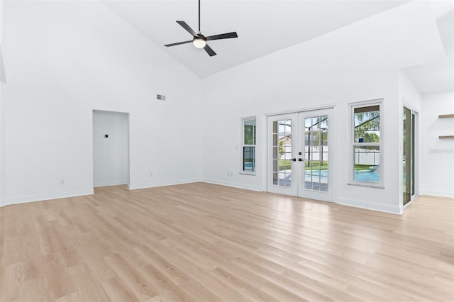 12106 Clearbrook Ct, Riverview, FL 33569 - empty room featuring high vaulted ceiling, light wood-style floors, french doors, and a ceiling fan
