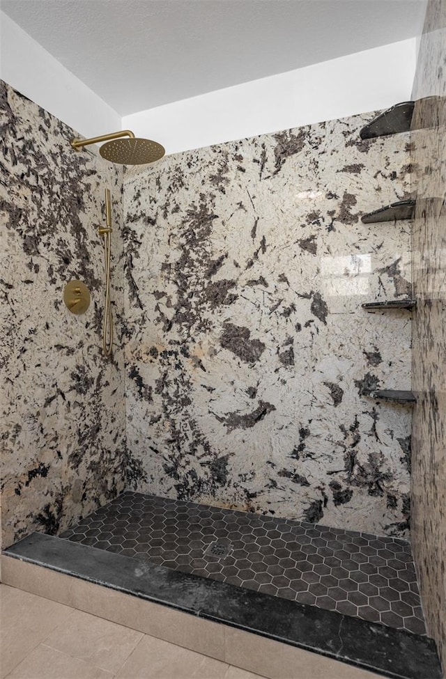 12106 Clearbrook Ct, Riverview, FL 33569 - bathroom with tiled shower and tile patterned floors