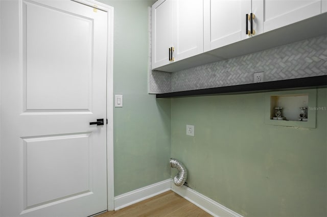 12106 Clearbrook Ct, Riverview, FL 33569 - laundry room featuring cabinet space, light wood-type flooring, and washer hookup
