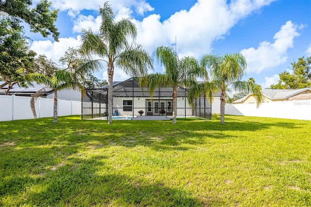 12106 Clearbrook Ct, Riverview, FL 33569 - rear view of property featuring french doors, a fenced backyard, a lanai, a swimming pool, and a patio area