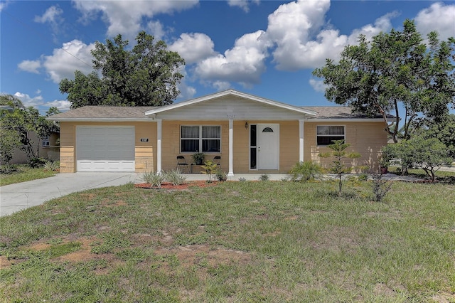 3707 Cambridge St, New Port Richey, FL 34652 - ranch-style house with an attached garage, a porch, concrete driveway, and a front yard