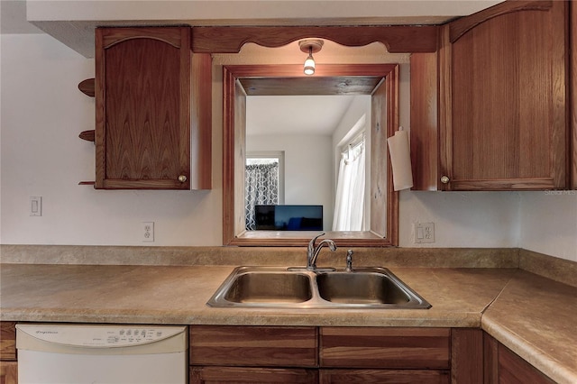 3707 Cambridge St, New Port Richey, FL 34652 - kitchen featuring white dishwasher and brown cabinetry