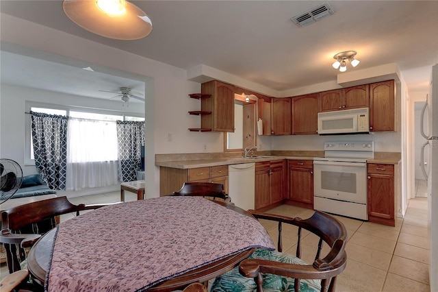 3707 Cambridge St, New Port Richey, FL 34652 - kitchen with white appliances, light tile patterned floors, open shelves, light countertops, and a ceiling fan