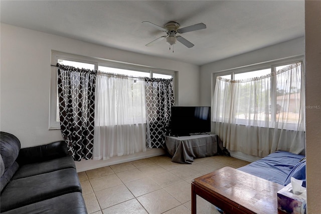 3707 Cambridge St, New Port Richey, FL 34652 - living area with a ceiling fan and light tile patterned floors