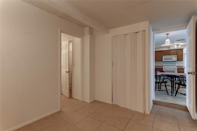 3707 Cambridge St, New Port Richey, FL 34652 - corridor with light tile patterned floors and baseboards