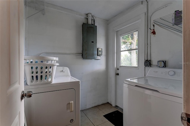 3707 Cambridge St, New Port Richey, FL 34652 - washroom featuring electric panel, separate washer and dryer, and light tile patterned floors