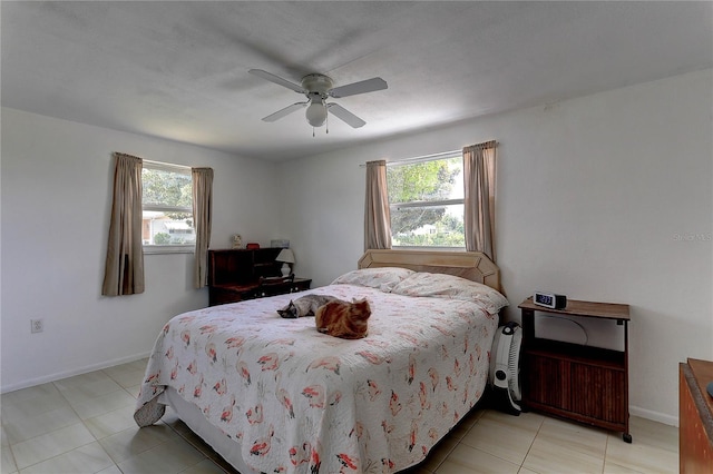 3707 Cambridge St, New Port Richey, FL 34652 - bedroom featuring multiple windows, ceiling fan, and light tile patterned floors