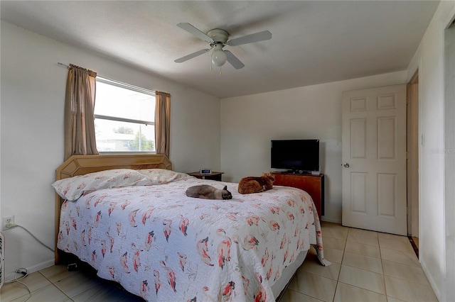 3707 Cambridge St, New Port Richey, FL 34652 - bedroom with light tile patterned floors and ceiling fan