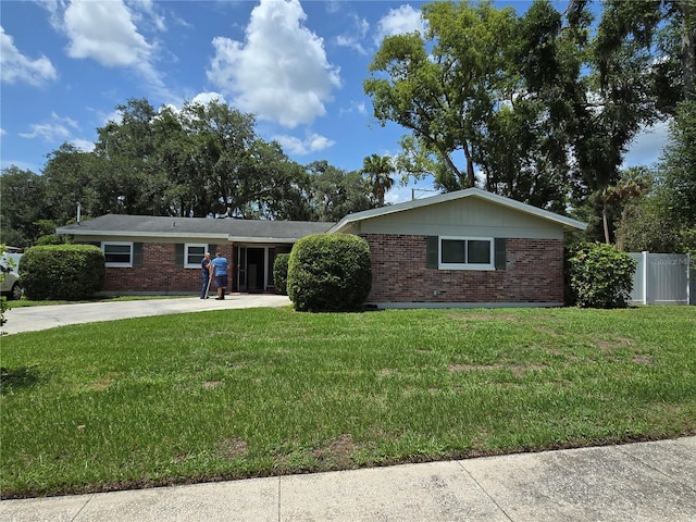 534 N Larry Cir, Brandon, FL 33511 - ranch-style house with brick siding and driveway