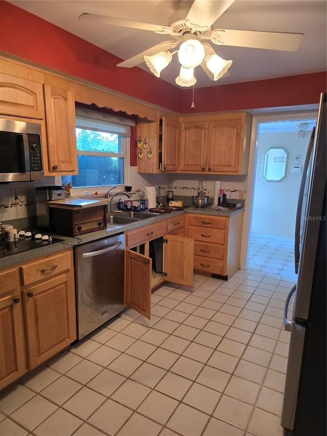 534 N Larry Cir, Brandon, FL 33511 - kitchen featuring appliances with stainless steel finishes, ceiling fan, dark countertops, light tile patterned floors, and light brown cabinets