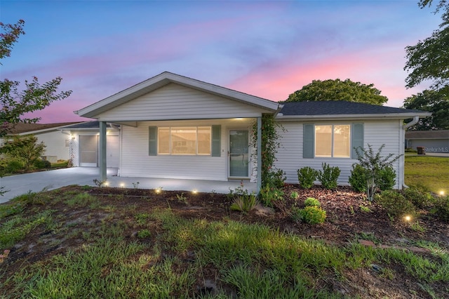 8851 SW 116th Street Rd, Ocala, FL 34481 - ranch-style home featuring concrete driveway, covered porch, and a garage