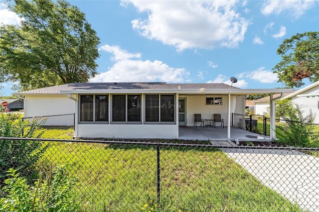 8851 SW 116th Street Rd, Ocala, FL 34481 - rear view of house featuring a sunroom and a patio