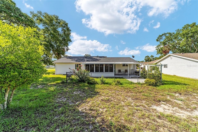8851 SW 116th Street Rd, Ocala, FL 34481 - back of house featuring a sunroom and a patio area