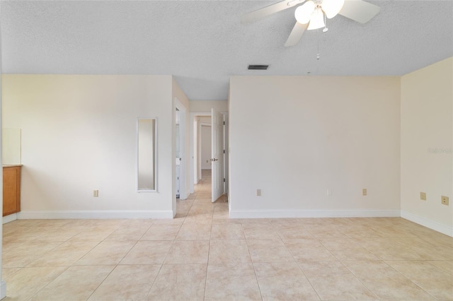 8851 SW 116th Street Rd, Ocala, FL 34481 - unfurnished room with ceiling fan, light tile patterned flooring, and a textured ceiling