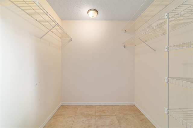 8851 SW 116th Street Rd, Ocala, FL 34481 - spacious closet featuring light tile patterned floors