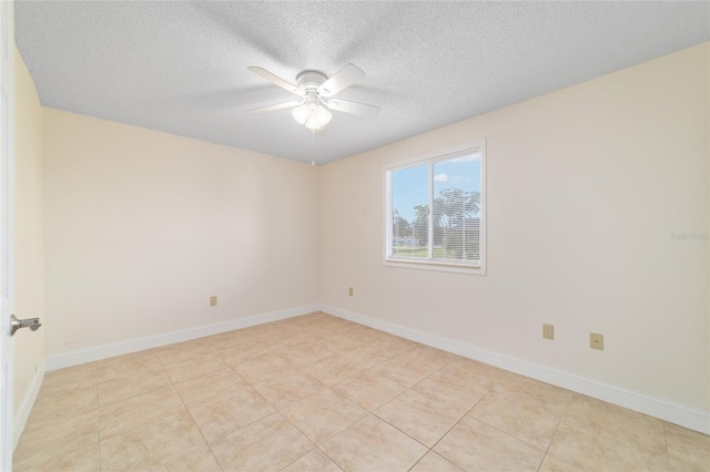 8851 SW 116th Street Rd, Ocala, FL 34481 - empty room featuring a ceiling fan, a textured ceiling, and light tile patterned floors