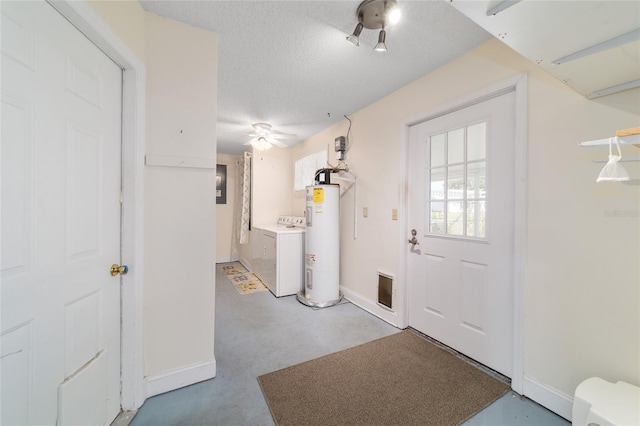 8851 SW 116th Street Rd, Ocala, FL 34481 - foyer featuring washer / clothes dryer, electric water heater, finished concrete floors, a textured ceiling, and ceiling fan
