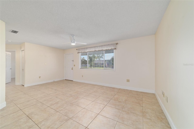8851 SW 116th Street Rd, Ocala, FL 34481 - unfurnished room featuring ceiling fan, light tile patterned floors, and a textured ceiling