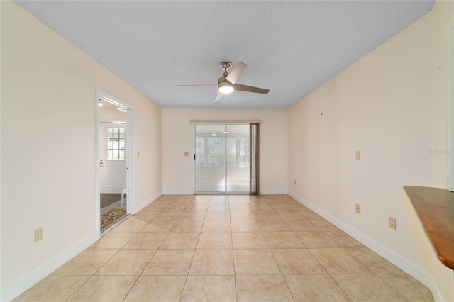 8851 SW 116th Street Rd, Ocala, FL 34481 - spare room with a ceiling fan and light tile patterned flooring