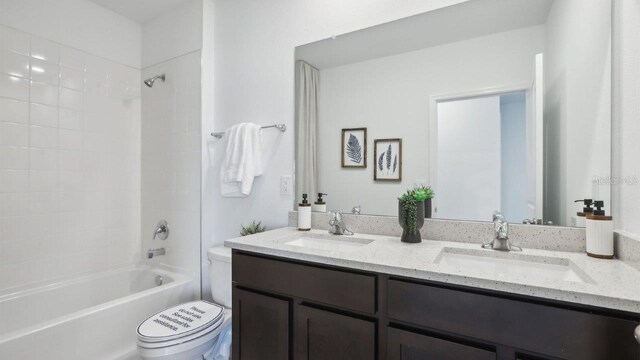 4359 Sand Dollar Way, Zephyrhills, FL 33541 - bathroom featuring double vanity and shower / washtub combination