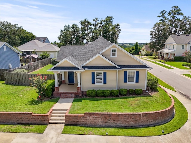 16609 NW 166th Dr, Alachua, FL 32615 - view of front of house with a porch, roof with shingles, and a residential view