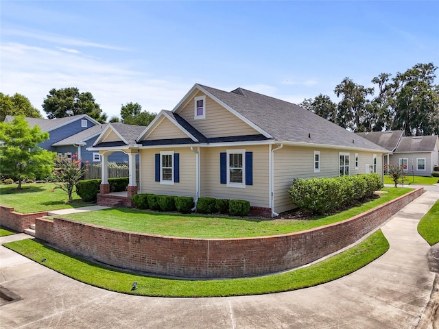 16609 NW 166th Dr, Alachua, FL 32615 - view of property exterior with a lawn and roof with shingles