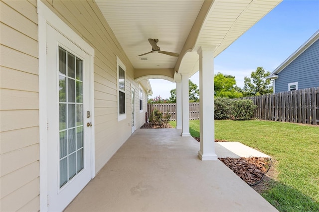 16609 NW 166th Dr, Alachua, FL 32615 - fenced backyard with a ceiling fan and a patio