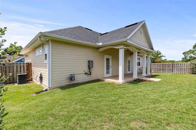 16609 NW 166th Dr, Alachua, FL 32615 - rear view of house featuring roof with shingles, a fenced backyard, and a patio area