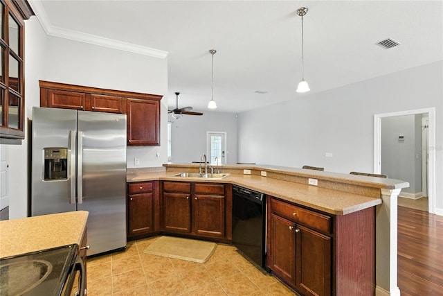 16609 NW 166th Dr, Alachua, FL 32615 - kitchen featuring black appliances, a peninsula, light countertops, ceiling fan, and hanging light fixtures