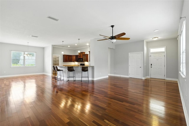 16609 NW 166th Dr, Alachua, FL 32615 - living area with hardwood / wood-style floors, a ceiling fan, and a chandelier